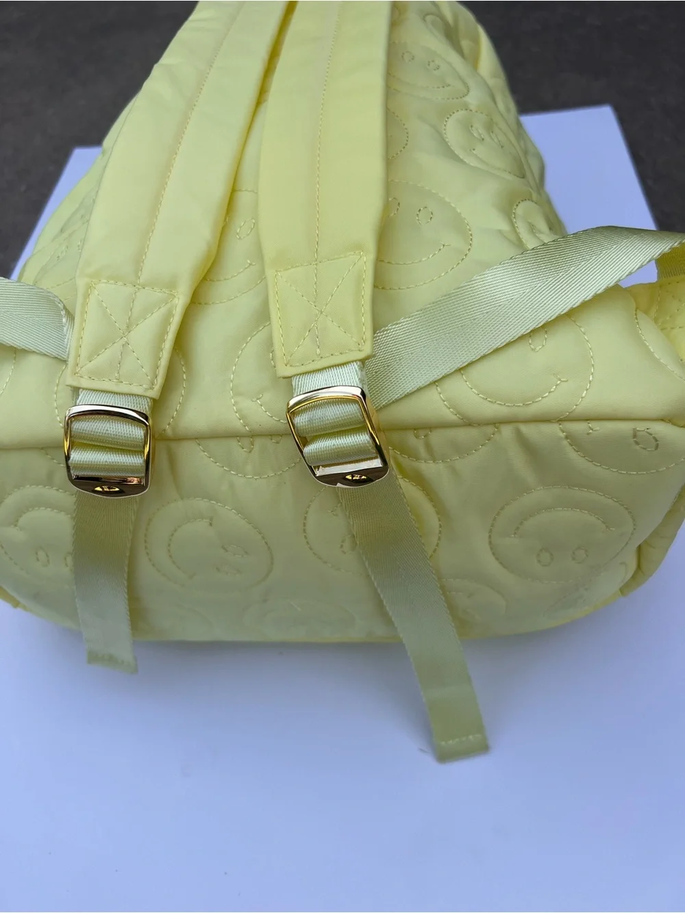 STONEY CLOVER LANE QUILTED SMILEY FACE BACKPACK